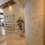 Product display area design - https://www.andyquinones.net Httpswww Andyquinones Net spa clinic product display area with rounded stacked stone wall interior design in miami florida